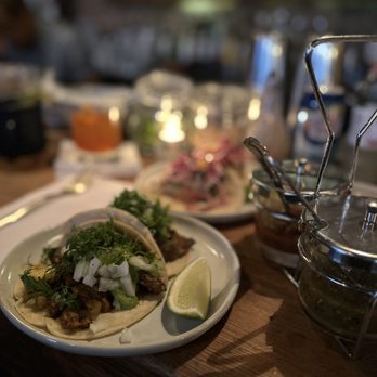 Barrio Chino - a plate of food on a table - Mexican Near Me - New York, New York
