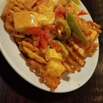 The Brick Kitchen + Lounge - Panang Poutine! Sounds strange at first but it is delicious! Bell peppers, tomatoes, waffle fries, etc. - Beer Bar Near Me - Renton, Washington The Brick Kitchen + Lounge - Panang Poutine! Sounds strange at first but it is delicious! Bell peppers, tomatoes, waffle fries, etc. - Beer Bar Near Me - Renton, Washington