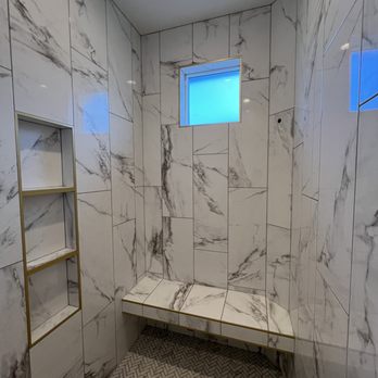 HSB Tile - a shower with a bench and a window - Tiling Near Me