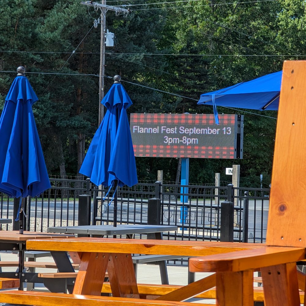 patio tables out front, play area for kids, exhibition tent out back. great venue