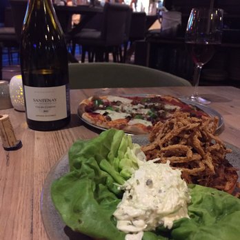 Moku Kitchen - Proletariat pizza, pulled pork sandwiched accompanied with a bottle of Pinot noir - Cocktail Bars Near Me - Honolulu, Hawaii Moku Kitchen - Proletariat pizza, pulled pork sandwiched accompanied with a bottle of Pinot noir - Cocktail Bars Near Me - Honolulu, Hawaii