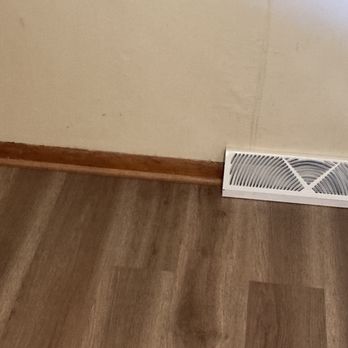 Unbreakable Roofing & Construction - a fan on the floor - Roofing Near Me