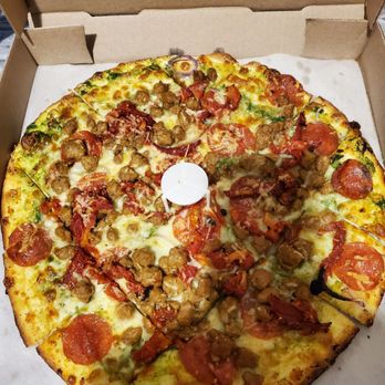 Paradise Park - Special K: Thin, crispy, and square cut. Italian sausage, sun-dried tomatoes, red onions, mozzarella, provolone + pepperoni - Pizza Near Me - Chicago, Illinois