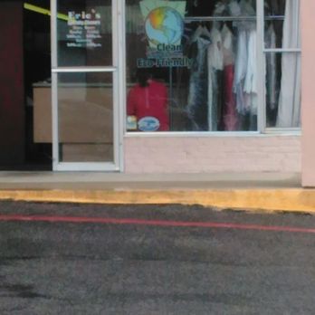 Eric's Specialty Cleaners - The other employee working sitting on a window ledge eating chips. - Sewing & Alterations Near Me - Metairie, Louisiana Eric's Specialty Cleaners - The other employee working sitting on a window ledge eating chips. - Sewing & Alterations Near Me - Metairie, Louisiana