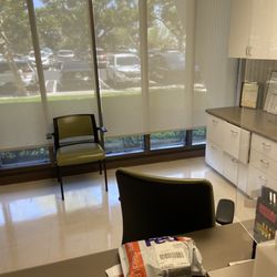 Quest Diagnostics - Two empty chairs where a receptionist should be