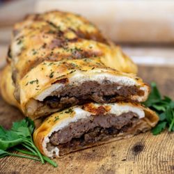 Homemade sausage, ricotta cheese, caramelized, onions, and mozzarella, stuffed bread