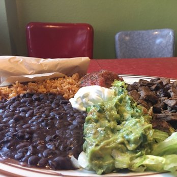 Robo Taco - The deluxe platter with carne asada, fresh steamy tortillas are in the brown wrapping - Mexican Near Me - Portland, Oregon Robo Taco - The deluxe platter with carne asada, fresh steamy tortillas are in the brown wrapping - Mexican Near Me - Portland, Oregon