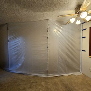 Peak Fire and Flood - Tenting off half the living room and the bedrooms in preparation for the machines to dry everything out. - Damage Restoration Near Me - Wheat Ridge, Colorado
