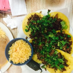 Taqueria Chapala - 4 mini tacos. Carne Asada w no onion. No charro beans just rice. Yummy.