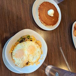 Skillet (eggs, mushrooms, cheese, onions, potato chips, etc) with side of 2 pancakes Skillet (eggs, mushrooms, cheese, onions, potato chips, etc) with side of 2 pancakes