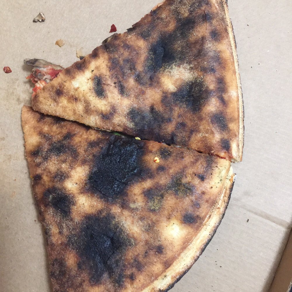 Burnt pizza crust. Some of it was even blacker than this. Burnt pizza crust. Some of it was even blacker than this.