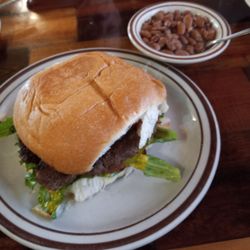 Hamburger 1/2 lb. Handformed patty Mustard, LT Chopped Onion, Extra Pickle + Bacon $3.99 + Jalapeños $1  Pinto Beans