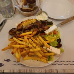 Pork souvlaki platter with fries, pita, salad $22 Pork souvlaki platter with fries, pita, salad $22