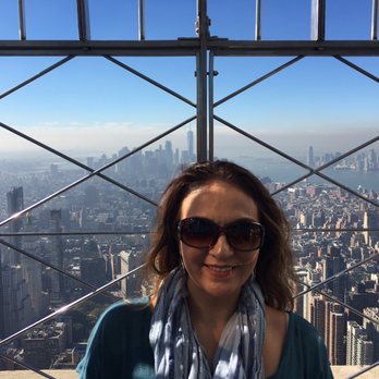 Travelstore - Brea - TravelStore's Lily enjoying the view from the Empire State Building - Travel Agents Near Me Travelstore - Brea - TravelStore's Lily enjoying the view from the Empire State Building - Travel Agents Near Me