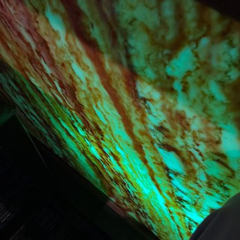 Suishaya - a person standing in front of a large screen - Sushi Bars Near Me - Columbia, South Carolina