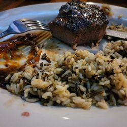 The All American Steakhouse & Sports Theater - Working thru a medium-well sirloin with wild rice (Center Cut USDA Sirloin) Had good-sized Ceasar salad along with.