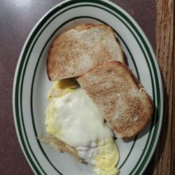 Sheri's Eastside Diner - One egg scrambled with cheese; sourdough toast.