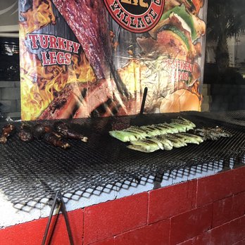 Backyard Bbq Village - a barbecue grill with meat and vegetables on it - Barbeque Near Me - Las Vegas, Nevada Backyard Bbq Village - a barbecue grill with meat and vegetables on it - Barbeque Near Me - Las Vegas, Nevada