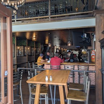 New Albany Tavern - From the street, both floors are visible through the garage doors - Beer Bar Near Me - New Albany, Indiana