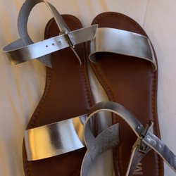 Silver strap on sandals.