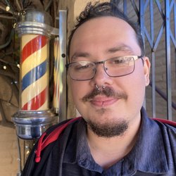 Carlyn's Barber Shop - Post-cut in front of shop
