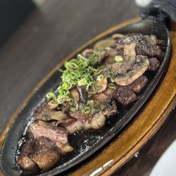 604 Clubhouse - Pupu steak on a sizzling platter!  Yummers