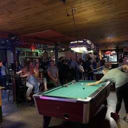 a pool table with a pool ball on it a pool table with a pool ball on it