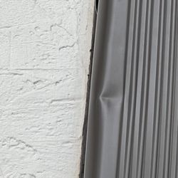 Denco Gutters and Exteriors - Installed down spouts with large dents.