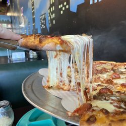 Brooklyn Pizza and Pasta - Large Triple meat Triple Cheese pizza. Look at that cheese pull!