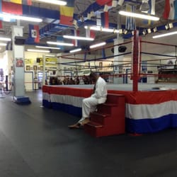 Rene's Dynamic Sports Center - The ring and kids working out in the background.