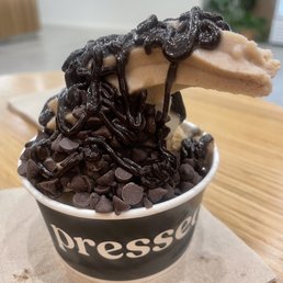 Vanilla soft serve with chocolate drizzle and chips