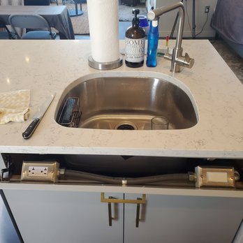 In Light Electric - Garbage disposal switch and plug mounted behind hidden panel. - Electricians Near Me In Light Electric - Garbage disposal switch and plug mounted behind hidden panel. - Electricians Near Me