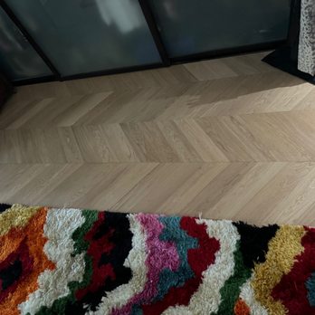 Rhodium Floors - a colorful rug on the floor - Flooring Near Me - Los Angeles, California Rhodium Floors - a colorful rug on the floor - Flooring Near Me - Los Angeles, California