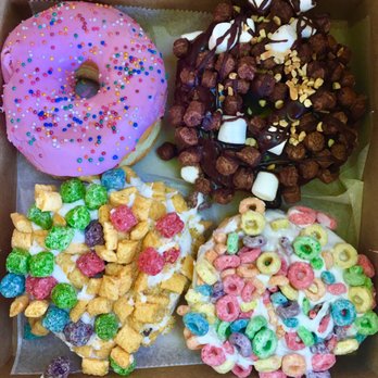 Voodoo Doughnut - Top left - Homer (Simpson) Top right - Rocky Road Bottom left - Capitan Crunch Bottom right - Fruit Loop - Donuts Near Me - Denver, Colorado Voodoo Doughnut - Top left - Homer (Simpson) Top right - Rocky Road Bottom left - Capitan Crunch Bottom right - Fruit Loop - Donuts Near Me - Denver, Colorado