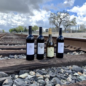 J&J Cellars - three bottles of wine on railroad tracks - Wineries Near Me - San Miguel, California J&J Cellars - three bottles of wine on railroad tracks - Wineries Near Me - San Miguel, California