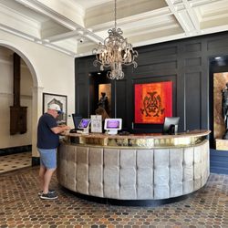 The Mayo Hotel - Hubby checking us in at the beautiful reception desk in the Mayo