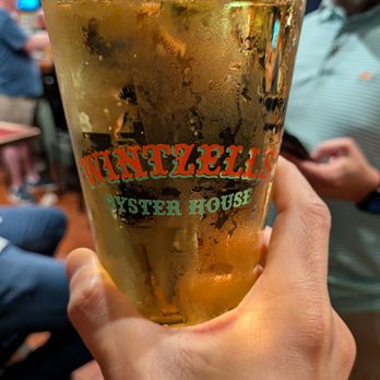 Wintzell's Oyster House - Cold, refreshing beer in a pint glass branded with Wintzell's Oyster House logo. - Seafood Near Me - Mobile, Alabama Wintzell's Oyster House - Cold, refreshing beer in a pint glass branded with Wintzell's Oyster House logo. - Seafood Near Me - Mobile, Alabama