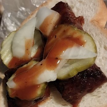 Smokey Mo's BBQ - Making a sandwich with the burnt ends, pickle, onion and supplied bread - Barbeque Near Me - San Antonio, Texas