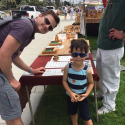 Sunday Art Walk - Wooden puzzles. The artist helped my son make many shapes.