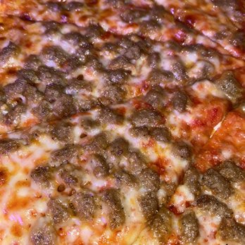 Memphis Pizza Cafe - a close up of a pizza - Pizza Near Me - Memphis, Tennessee