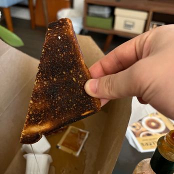 Fuller's Coffee Shop - a hand holding a piece of toast - Diners Near Me - Portland, Oregon Fuller's Coffee Shop - a hand holding a piece of toast - Diners Near Me - Portland, Oregon