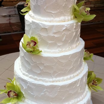 Gwen's Cake Decorating & Etc - a three tiered cake with green flowers - Bakeries Near Me - Saline, Michigan