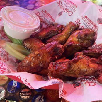 Champy's Famous Fried Chicken - Smoked wings tossed in 'Sweet Heat' sauce with celery and blue cheese - Southern Near Me - Alabaster, Alabama