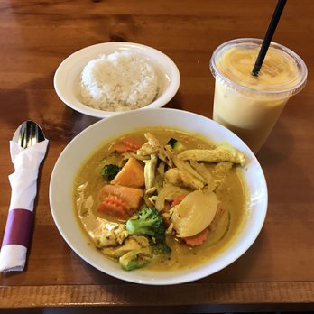Curry in the Box - a plate of food and a drink - Indian Near Me - Madison, Wisconsin Curry in the Box - a plate of food and a drink - Indian Near Me - Madison, Wisconsin