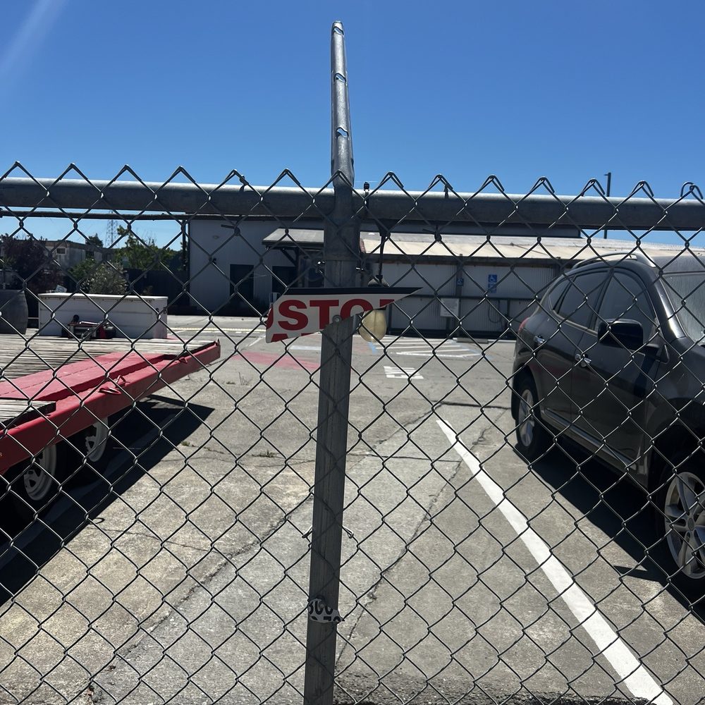 Here's the "sign" saying I would be towed if I parked here! What a racket!
