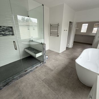 California Home Center - Walk-in shower and freestanding tub - General Contractors Near Me