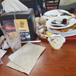 Dishes we ate on at Golden Corral piled up on our table because no server ever came to take them away or refill our drinks.