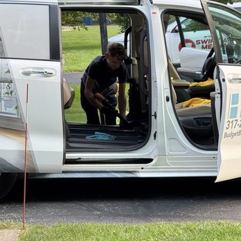 Cruz’s Mobile Detailing - Gavin the owner and technician sweeping floor with vacuum - Auto Detailing Near Me Cruz’s Mobile Detailing - Gavin the owner and technician sweeping floor with vacuum - Auto Detailing Near Me