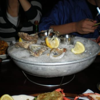 Pappadeaux Seafood Kitchen - One of the dozen oysters - we obviously already got our hands into it. - Seafood Near Me - Austin, Texas
