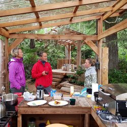 Discovery Expeditions - Base camp cook house guests chatting.
